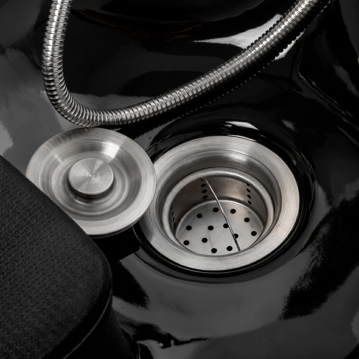 Omega Marina Black hairdressing wash unit with a sleek black basin and professional salon design.