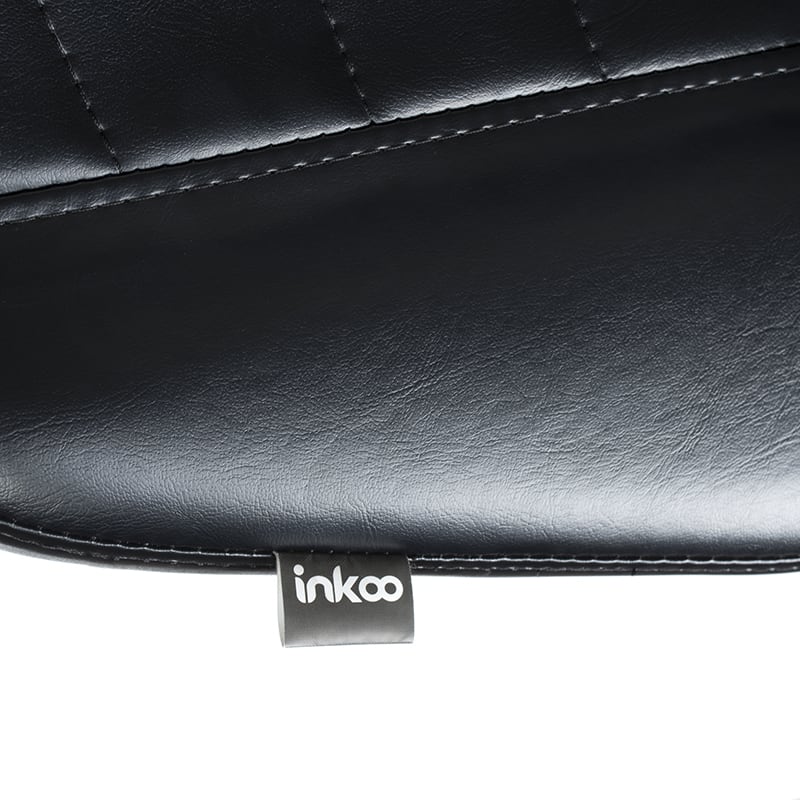 Tattoo artist armrest and stool by SIMI INKOO from Beauty System, featuring comfortable padding and adjustable height for tattoo sessions.
