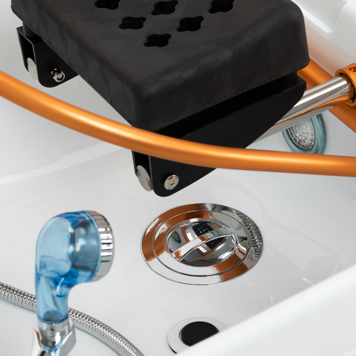 Gabbiano Head Spa Maldives hair washing bed in beige with cushioned surface and headrest for relaxing hair treatments.