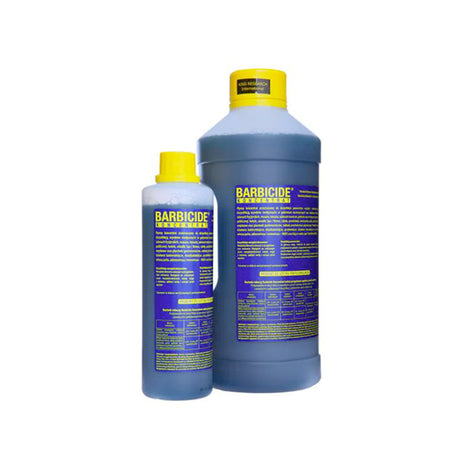 Barbicide disinfectant concentrate bottle for cleaning tools and accessories, 1900 ml, with label showing brand and product details.