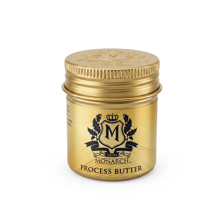 A small cylindrical gold jar of Skin Monarch Process Butter
