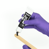 Unistar Cup Ink Glue 50g in a small plastic cup, showing the adhesive inside for crafting and bonding projects.
