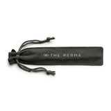 The Perma Microblading Holder by The Perma holding microblading tools on a clean workspace.