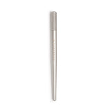 The Perma Microblading Holder by The Perma, a sleek tool for organizing microblading pens and tools on a clean workspace.